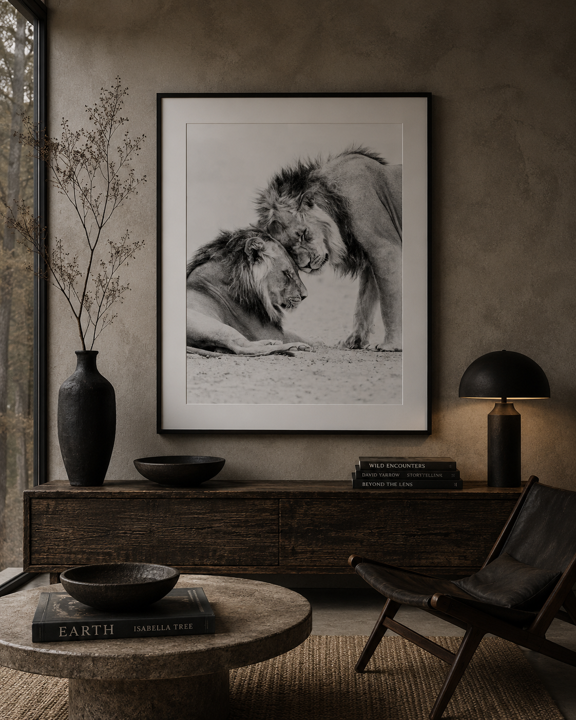 Framed black and white fine art print of two male lions resting together by Richard du Toit, displayed in a refined neutral interior